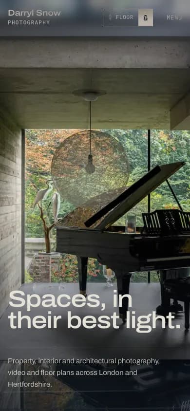 Mobile hero: a grand piano in a concrete room under the headline 'Spaces, in their best light.' with a floor indicator in the header.
